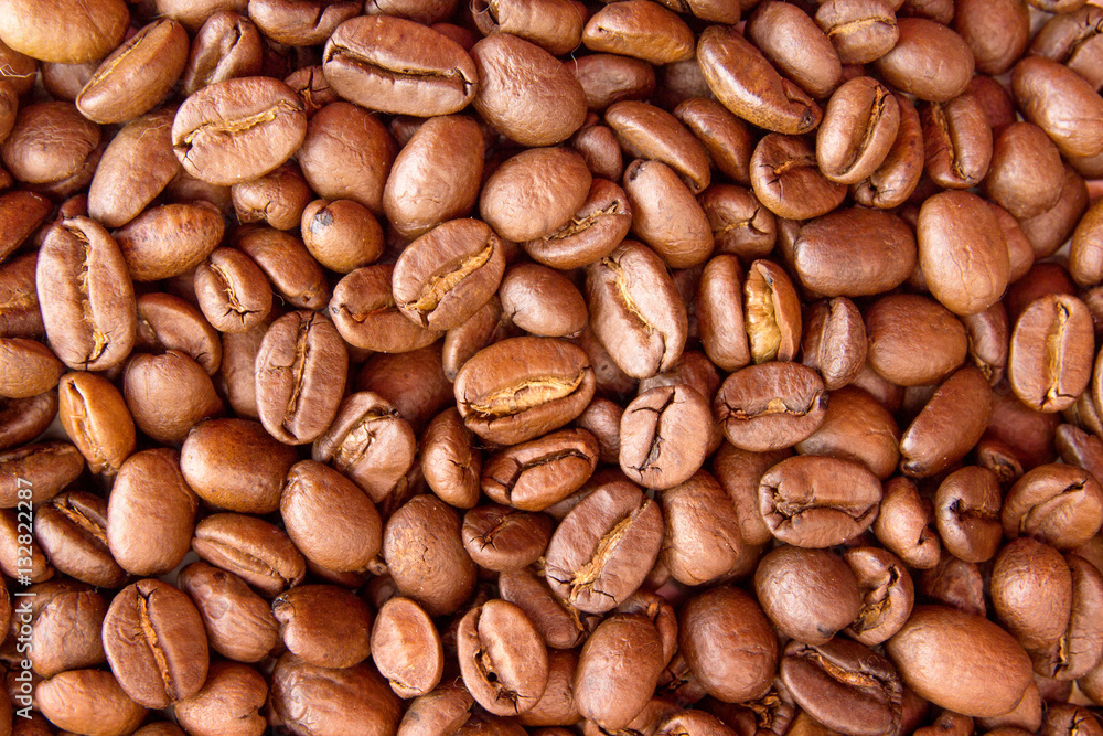 Coffee background. Heap roasted coffee beans. Top view. Coffee background. Heap roasted coffee beans. Top view.