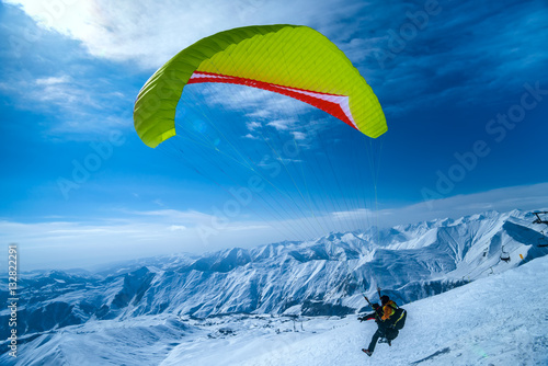 Winter in Greater Caucasus Mountains. Georgia (country). Gudauri ski resort. Paragliding