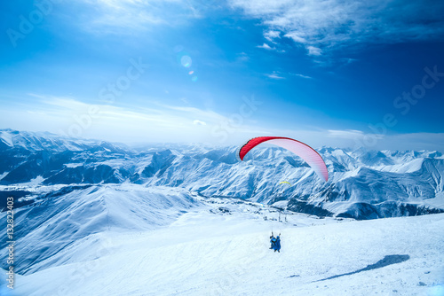 Winter in Greater Caucasus Mountains. Georgia (country). Gudauri ski resort. Paragliding