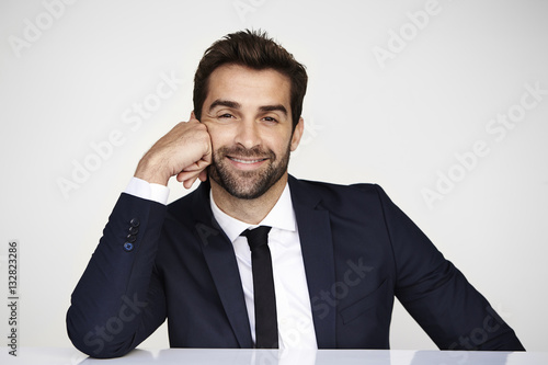 Businessman in suit  smiling at camera