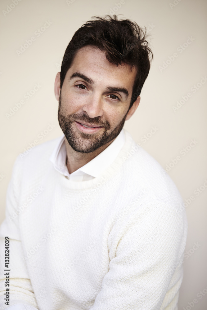 Guy in white sweater, smiling Guy in white sweater, smiling