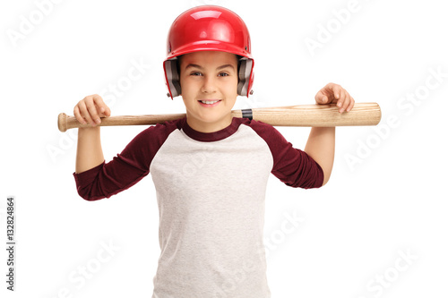 Joyful little boy posing with a baseball bat