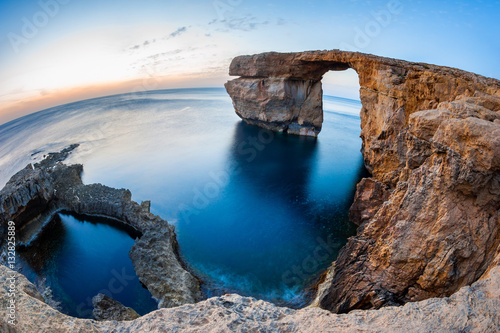 Fisheye View of the Azure Window, a natural arched rock in Dwejra, Gozo, Malta. photo