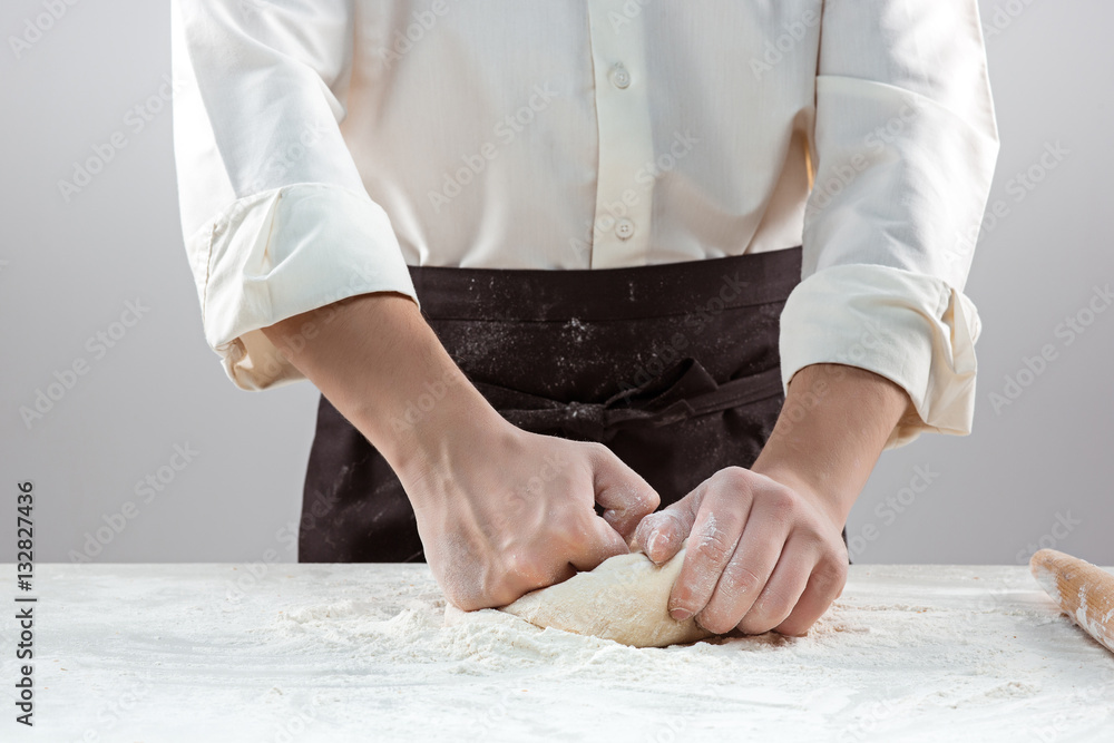 Hands kneading a dough