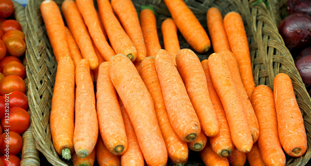 basket of orange carrots for sale at the greengrocer basket of orange carrots for sale at the greengrocer