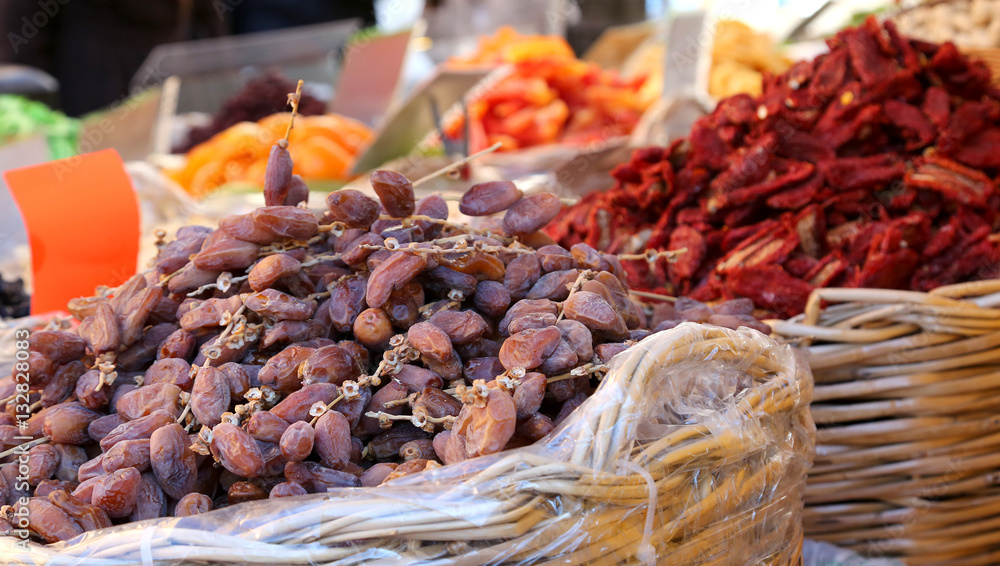 dates and dried tomatoes for sale at the fruit market of souther dates and dried tomatoes for sale at the fruit market of souther