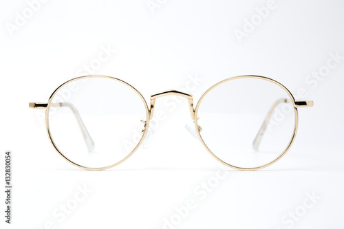 classic gold round glasses on white background