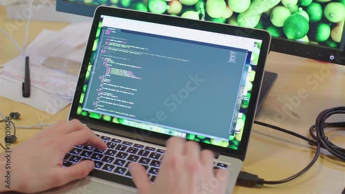 The programmer creates an application for laptop.