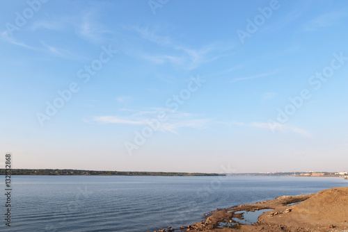   lear warm day on the coastline with a beautiful horizon and sk