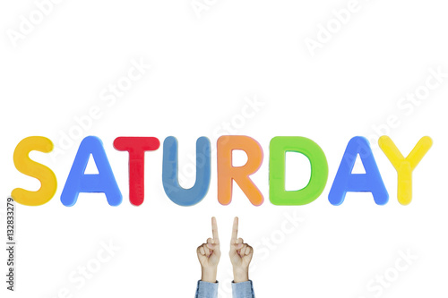 Hands point to wording "SATURDAY" on white background