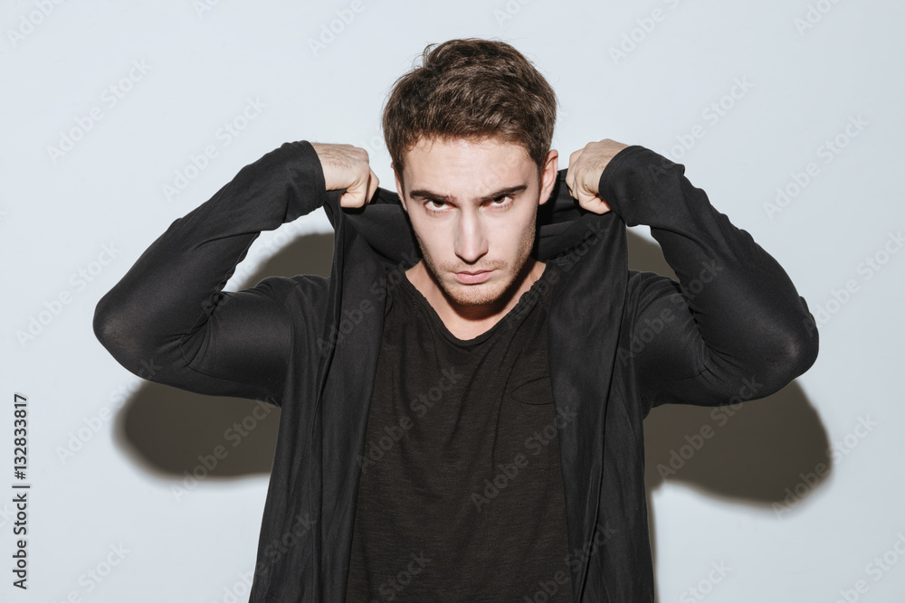 Handsome man standing over white background. Handsome man standing over white background.