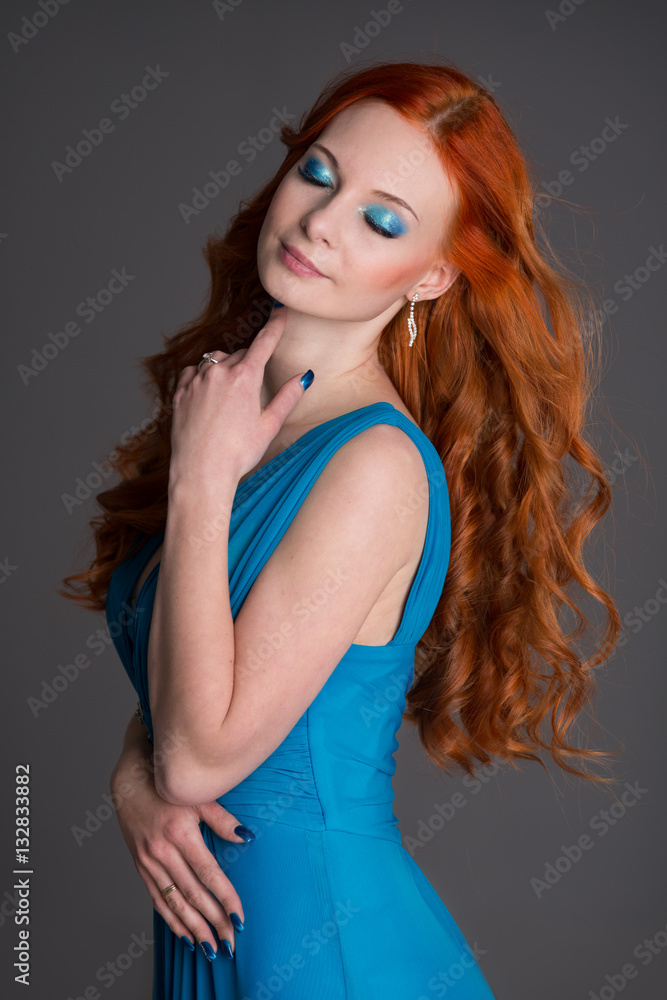 Naklejka premium young woman with red hair.