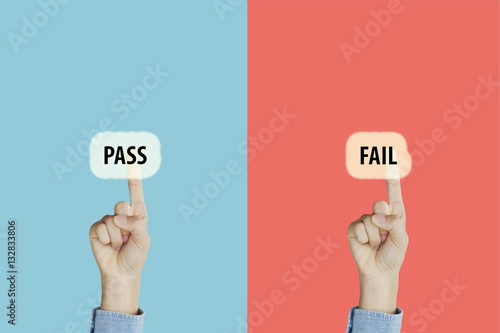Hands fingers pointing with index fingers to pass and fail text