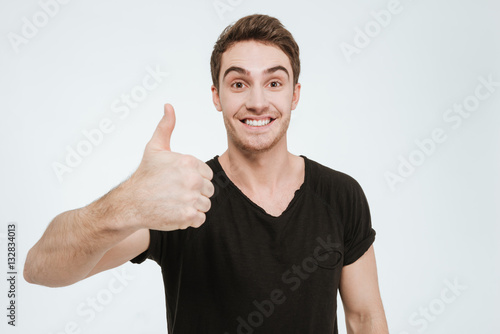 Happy man showing thumbs up gesture.