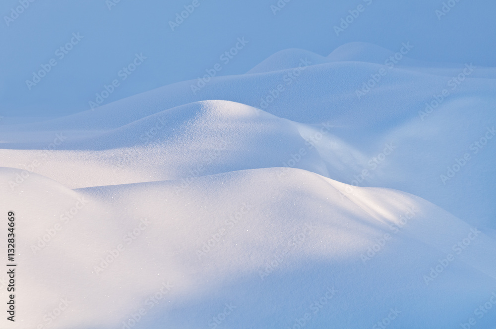 Natural winter texture. Snow snowdrifts in a soft diffused light