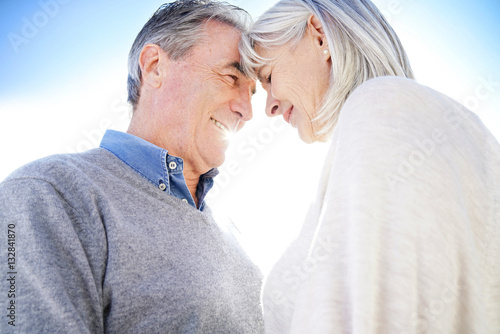 Portrait of senior couple embracing each other