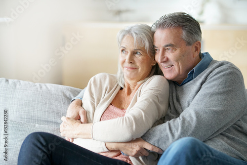 Portrait of senior couple relaxing in sofa
