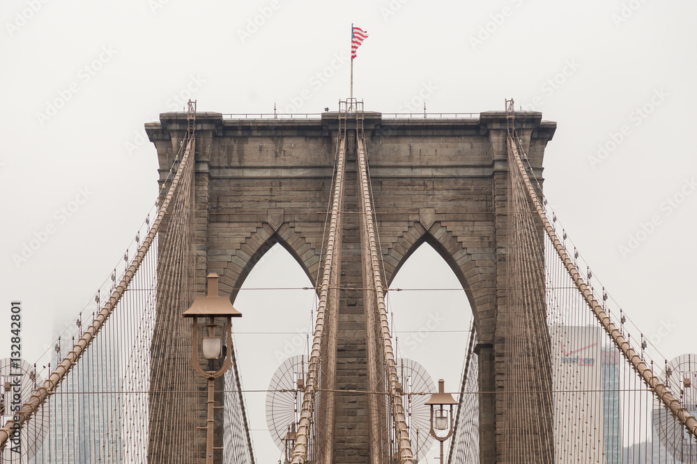 Fototapeta premium Views across the bridge walking the Brooklyn Bridge in New York