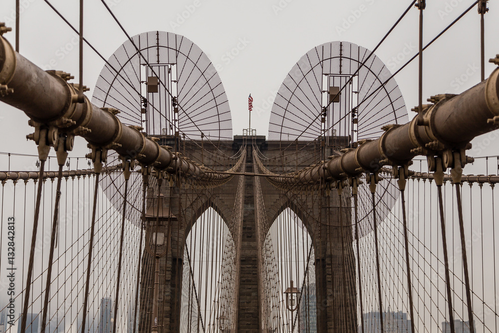Naklejka premium Views across the bridge walking the Brooklyn Bridge in New York