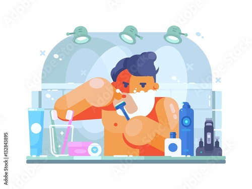 Man in bathroom shaves