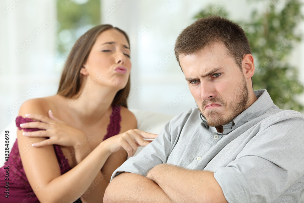 Angry man rejecting a sex offer from his girlfriend Angry man rejecting a sex offer from his girlfriend