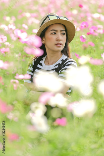 portrait of young beautiful girl in the flower field