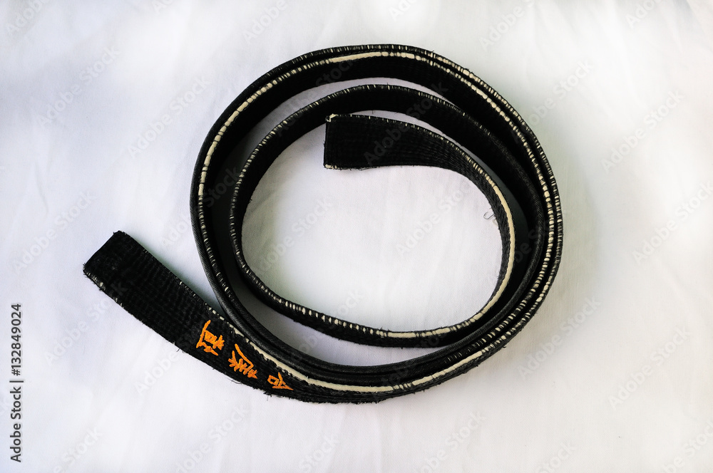 Black belt.The belt of three Japanese characters of traditional Japanese martial arts. As English is the Ai-Ki-Do. The first character Ai - harmony. Ki- the spirit. Do - way. Black belt.The belt of three Japanese characters of traditional Japanese martial arts. As English is the Ai-Ki-Do. The first character Ai - harmony. Ki- the spirit. Do - way.