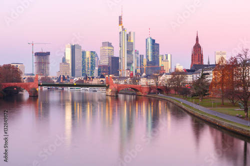 Picturesque view of business district with skyscrapers and mirror reflections in the river at sunrise  Frankfurt am Main  Germany