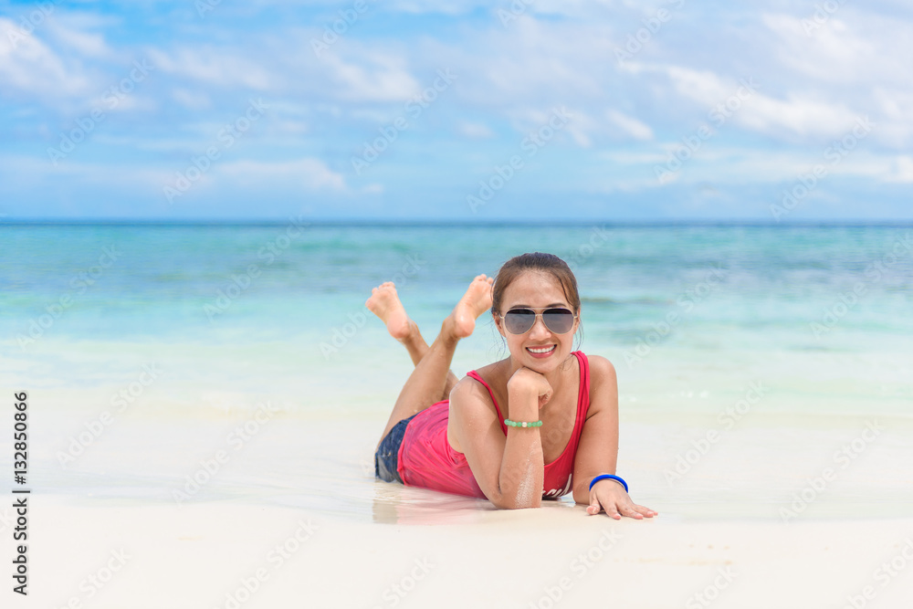 young woman and sunglasses lying on beach young woman and sunglasses lying on beach