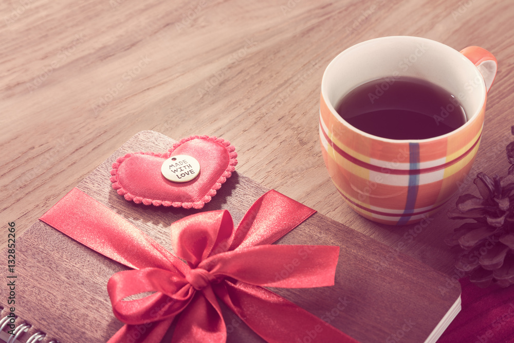 notebook wrapped with red ribbon, red felt hearts in vintage pin