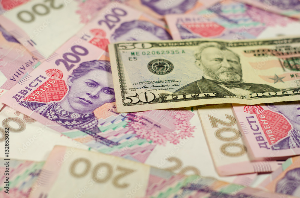 Fifty dollars banknote on the background of ukrainian hryvnas Fifty dollars banknote on the background of ukrainian hryvnas