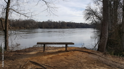 Bench on the end at river