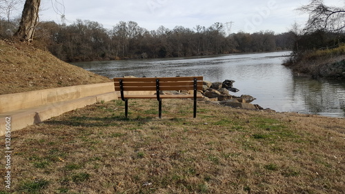 Bench overlooking rocks in the river
