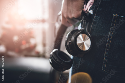 Man holding headphones photo