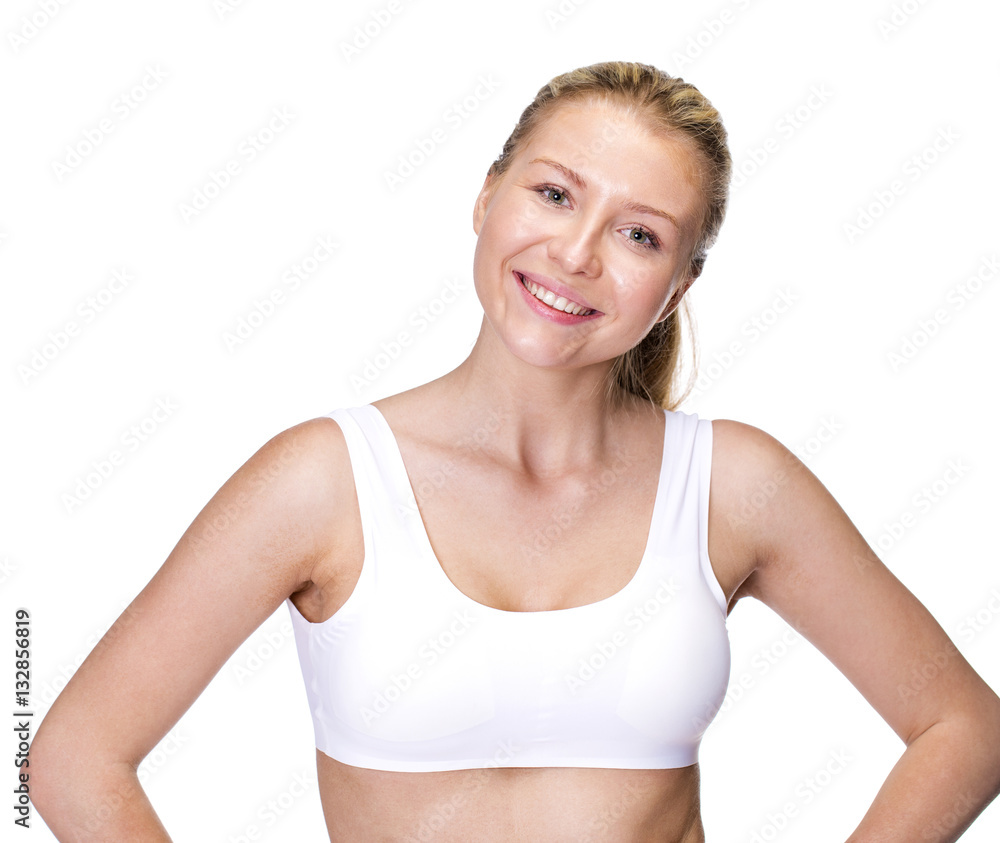 Young beautiful blonde woman in white fitness clothing