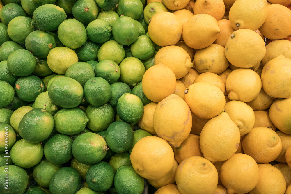 Counter with fresh citrus fruits from a market, lime and lemons, very colorful and vibrant. Counter with fresh citrus fruits from a market, lime and lemons, very colorful and vibrant.