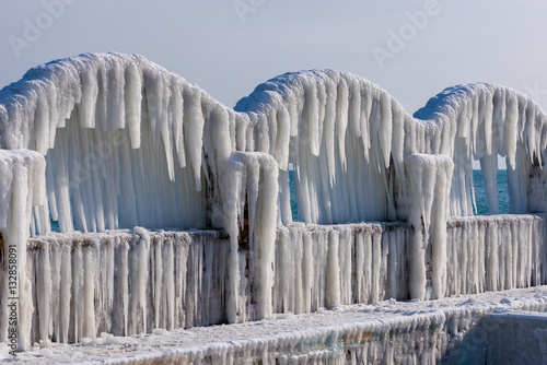 Icicles over the arches of the abandoned swimming pool by the sea