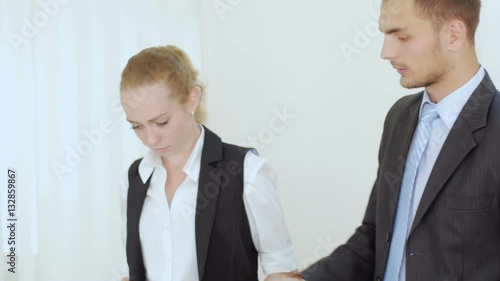 Wallpaper Mural A businessman and businesswoman are working at the computer Torontodigital.ca