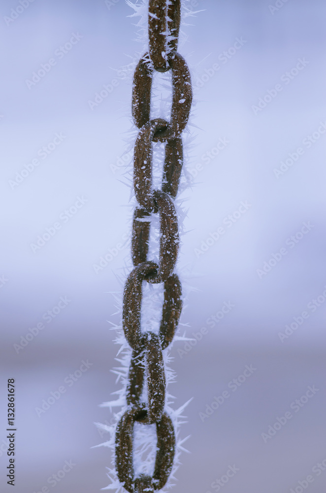 Iron chain covered with frost. Iron chain covered with frost.
