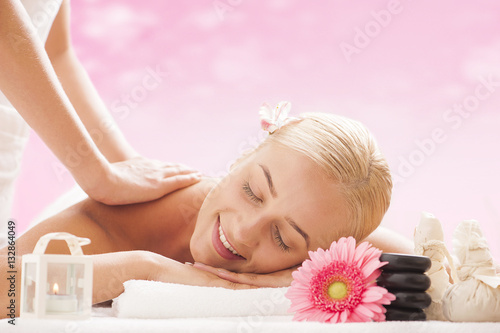 Young attractive woman getting massaging treatment 
