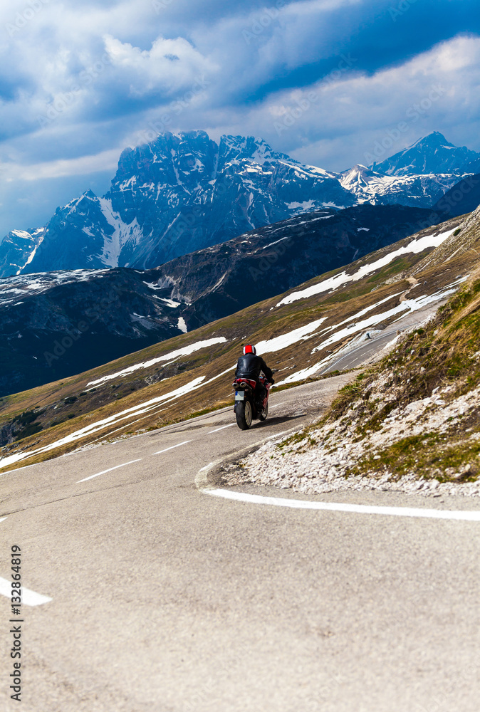 Motorcyclists on mountain bend road pass,Tre cime di Lavaredo, Dolomites, Italy.
