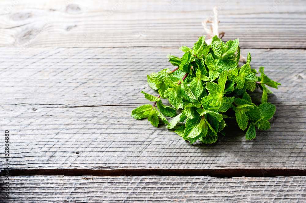 Fresh mint on rustic wooden background Fresh mint on rustic wooden background