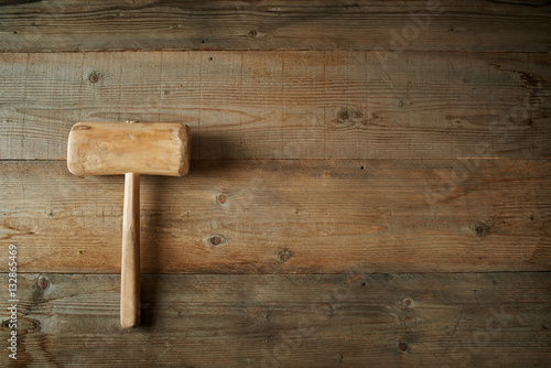 Top view, mallet on a wooden workbench