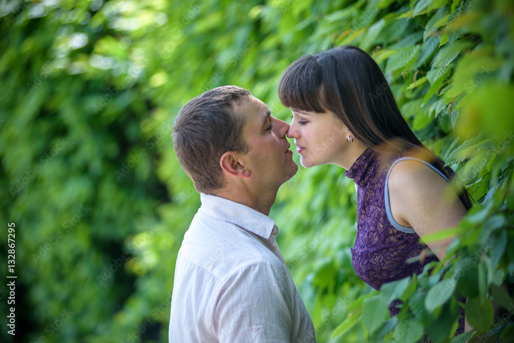 Loving young couple walk on the park at summer. Loving young couple walk on the park at summer.
