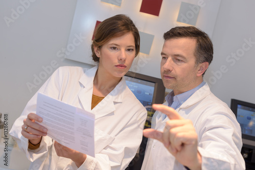 Obraz na plátně opticians working in the laboratory