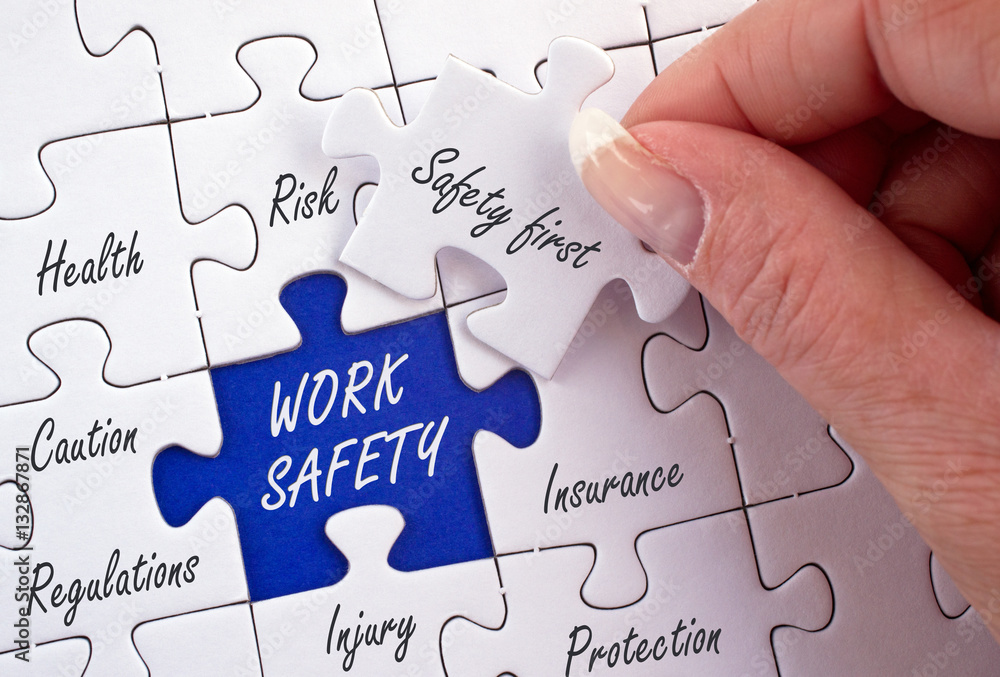 Work Safety Puzzle with female hand and text Work Safety Puzzle with female hand and text