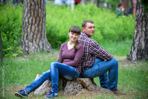 Loving young couple walk on the park at summer. © pahis