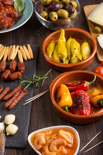Spanish tapas starters on wooden table