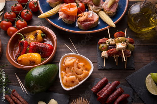 Spanish tapas starters on wooden table