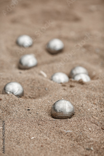 Bocce petanque balls on sand beach